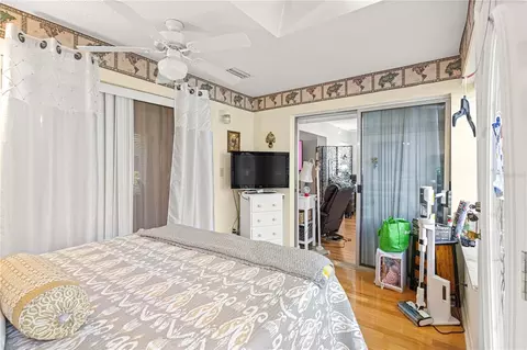 Bedroom - 8874 SW 95th St #E, Ocala, FL 34481 photo 7 of 7