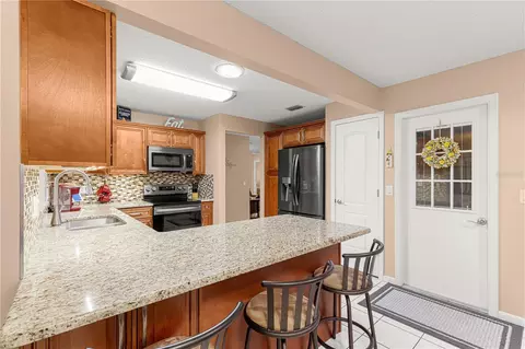 Kitchen - 9256 SW 82nd Ter #E, Ocala, FL 34481 photo 4 of 4