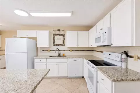 Kitchen - 8702 SW 94th St #E, Ocala, FL 34481 photo 2 of 6