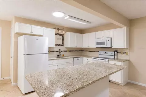 Kitchen - 8702 SW 94th St #E, Ocala, FL 34481 photo 3 of 6