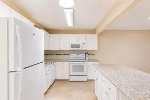Kitchen - 8702 SW 94th St #E, Ocala, FL 34481 photo 4 of 6