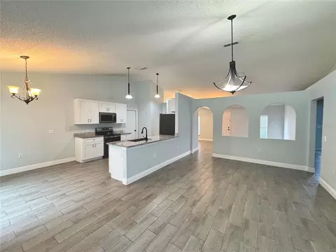 Living - 3243 Greynolds Ave, Spring Hill, FL 34608 photo 1 of 8