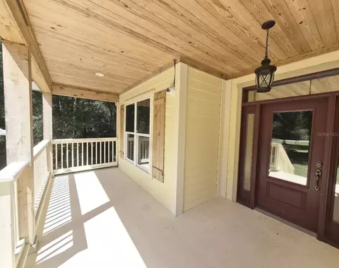 Exterior - 18216 SW 68th Loop, Dunnellon, FL 34432 photo 4 of 7