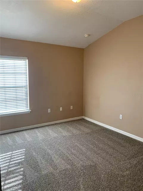 Bedroom - 7117 Harmony Square Dr S #7117, Harmony, FL 34773 photo 7 of 9