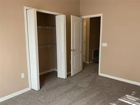 Bedroom - 7117 Harmony Square Dr S #7117, Harmony, FL 34773 photo 6 of 9