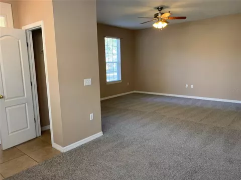 Living - 7117 Harmony Square Dr S #7117, Harmony, FL 34773 photo 3 of 7