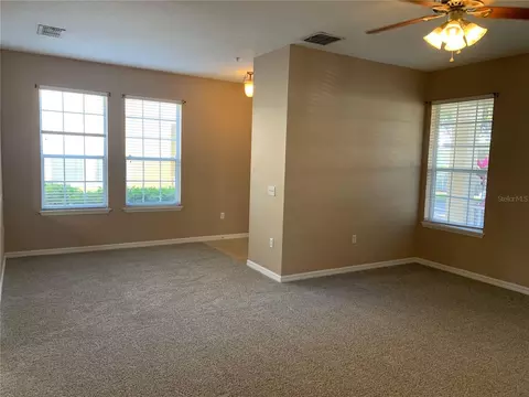 Living - 7117 Harmony Square Dr S #7117, Harmony, FL 34773 photo 4 of 7