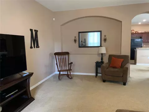 Living - 7117 Harmony Square Dr S #7117, Harmony, FL 34773 photo 6 of 7