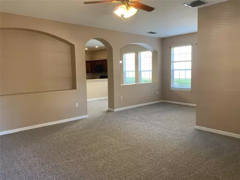 Living - 7117 Harmony Square Dr S #7117, Harmony, FL 34773 photo 2 of 7