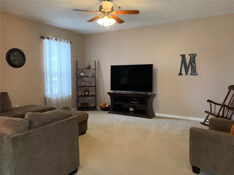 Living - 7117 Harmony Square Dr S #7117, Harmony, FL 34773 photo 5 of 7