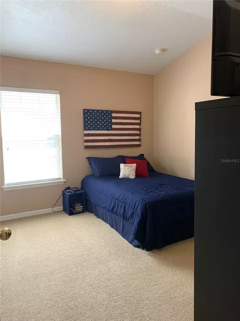 Bedroom - 7117 Harmony Square Dr S #7117, Harmony, FL 34773 photo 2 of 9