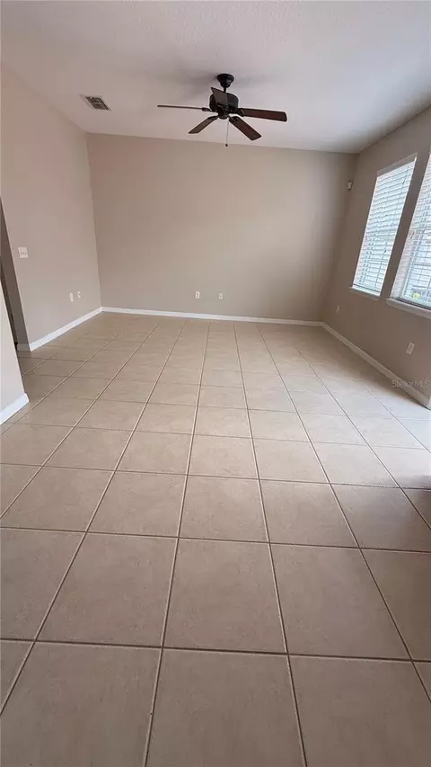 Living - 7108 Five Oaks Dr, Harmony, FL 34773 photo 4 of 7