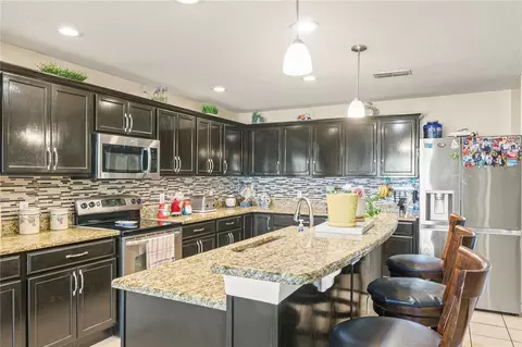 Kitchen - 4071 Flowering Peach Ln, Saint Cloud, FL 34772 photo 4 of 5
