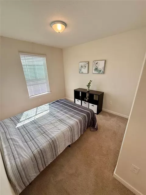 Bedroom - 10923 Leafshore Loop, Orlando, FL 32829 photo 4 of 10