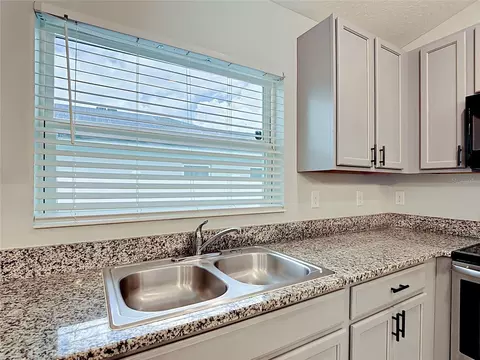 Kitchen - 3040 Lakes Crest Ave, Saint Cloud, FL 34772 photo 7 of 8