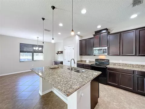 Kitchen - 5121 Appenine Loop W, Saint Cloud, FL 34771 photo 2 of 3