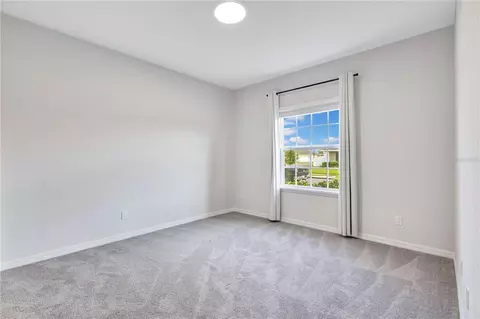 Bedroom - 5447 Pine Lilly Dr, Saint Cloud, FL 34771 photo 6 of 7