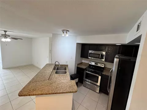Kitchen - 4532 Commander Dr #2128, Orlando, FL 32822 photo 2 of 3