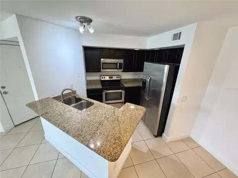 Kitchen - 4532 Commander Dr #2128, Orlando, FL 32822 photo 1 of 3