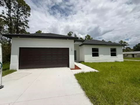Exterior - 723 Epps Brown St E, Lehigh Acres, FL 33974 photo 3 of 12