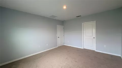 Bedroom - 486 Pine Tree Bridge Trl, Saint Cloud, FL 34772 photo 6 of 13