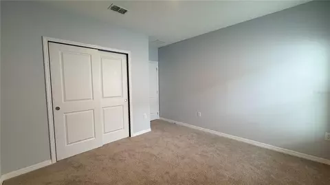 Bedroom - 486 Pine Tree Bridge Trl, Saint Cloud, FL 34772 photo 8 of 13