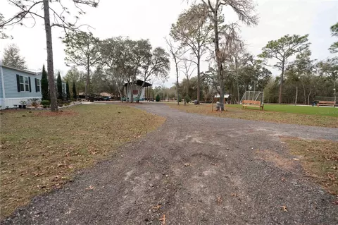 Exterior - 7670 NE 97th Ct, Bronson, FL 32621 photo 11 of 12