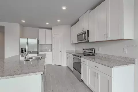 Kitchen - 7041 Feather River Pl, Parrish, FL 34219 photo 2 of 4