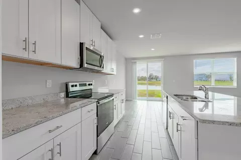 Kitchen - 7041 Feather River Pl, Parrish, FL 34219 photo 3 of 4