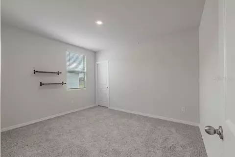 Bedroom - 7041 Feather River Pl, Parrish, FL 34219 photo 4 of 5