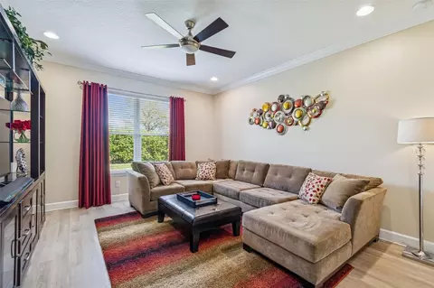 Living - 7447 Lancaster Loop, Wesley Chapel, FL 33545 photo 13 of 14