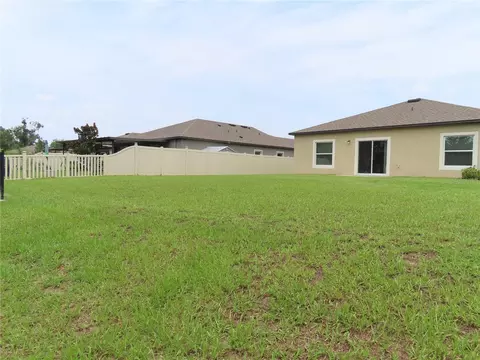 Exterior - 13149 Conquistador Loop, Spring Hill, FL 34610 photo 6 of 12