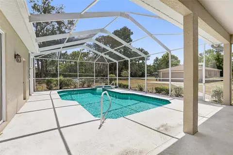 Exterior - 13185 Cooper Rd, Spring Hill, FL 34609 photo 10 of 18