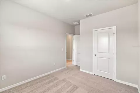 Bedroom - 5592 Coopers Hawk Ct, Saint Cloud, FL 34772 photo 5 of 7