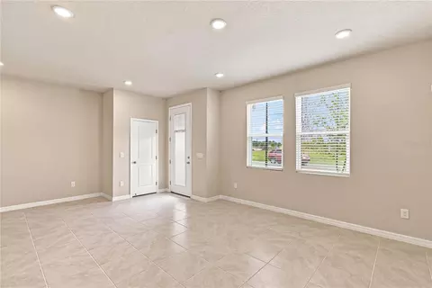Living - 5592 Coopers Hawk Ct, Saint Cloud, FL 34772 photo 4 of 5