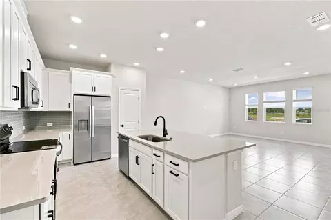 Kitchen - 5596 Coopers Hawk Ct, Saint Cloud, FL 34772 photo 5 of 7