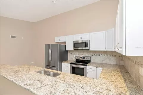 Kitchen - 3367 Crystal Ct E #E, Palm Harbor, FL 34685 photo 4 of 6