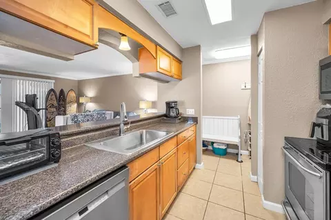 Kitchen - 10195 Sailwinds Blvd N #201, Largo, FL 33773 photo 4 of 7