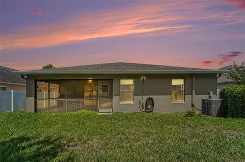 Exterior - 10048 Ives Loop, Hudson, FL 34667 photo 3 of 11