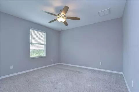 Bedroom - 1621 Leaf Flower Ln, Lutz, FL 33558 photo 3 of 7
