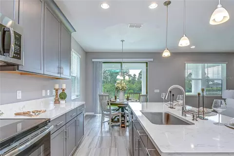 Kitchen - 1621 Leaf Flower Ln, Lutz, FL 33558 photo 7 of 8