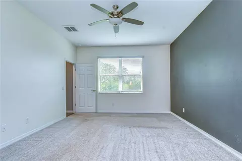 Bedroom - 1621 Leaf Flower Ln, Lutz, FL 33558 photo 1 of 7