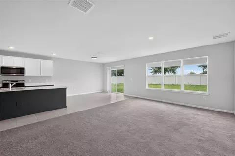 Living - 6708 Devlin Ln, Wesley Chapel, FL 33545 photo 3 of 13