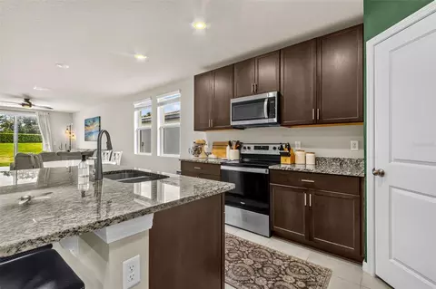 Kitchen - 7017 Feather River Pl, Parrish, FL 34219 photo 2 of 4