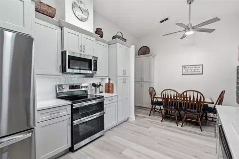 Kitchen - 8185 Rhanbuoy Rd, Spring Hill, FL 34606 photo 3 of 8