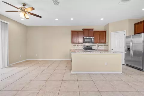 Living - 8961 Turnstone Haven Pl, Tampa, FL 33619 photo 6 of 7