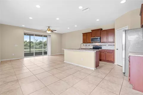 Living - 8961 Turnstone Haven Pl, Tampa, FL 33619 photo 1 of 7