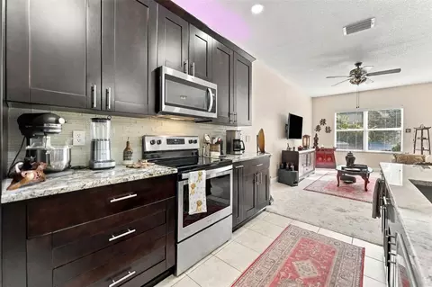 Kitchen - 9234 Stone River Pl, Riverview, FL 33578 photo 2 of 7