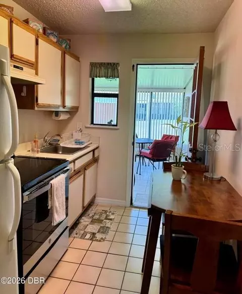 Kitchen - 156 Cardinal Dr #A, Ormond Beach, FL 32176 photo 1 of 2