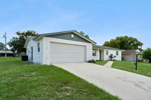 Exterior - 1679 E Apache Cir, Deltona, FL 32725 photo 4 of 9